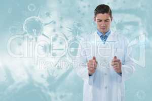 Composite image of concentrated male doctor using futuristic glass 3d