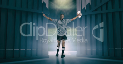 Composite image of rear view of athlete with arms raised holding rugby ball 3d
