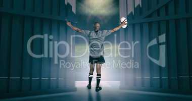 Composite image of rear view of athlete with arms raised holding rugby ball 3d