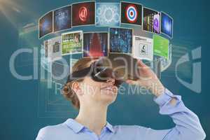 Composite image of low angle view of businesswoman using virtual reality headset 3d