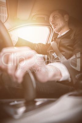 Handsome businessman on drivers seat