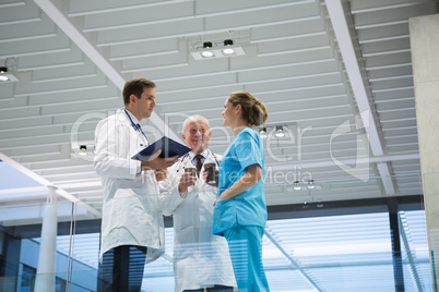 Doctors and surgeon interacting with each other while having coffee