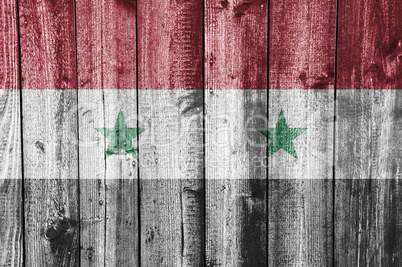 Fahne von Syrien auf verwittertem Holz