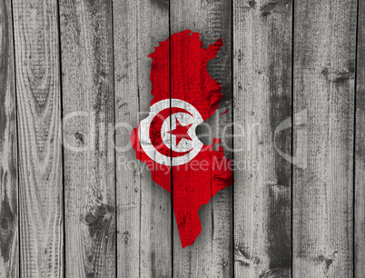 Karte und Fahne von Tunesien auf verwittertem Holz