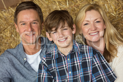 Happy Man Woman Boy Child Family on Hay Bales