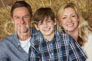 Happy Man Woman Boy Child Family on Hay Bales