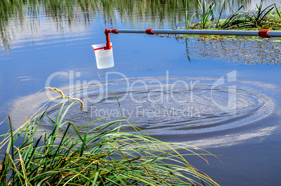 Take samples of water for laboratory testing. The concept - analysis of water purity, environment, ecology.