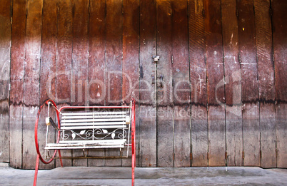 Chinese old building exterior with door and single chair in Thai