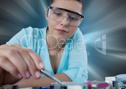 Woman with electronics against motion blur