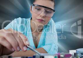 Woman with electronics against motion blur