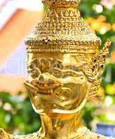 Golden statue in Wat Phra Keao in the Grand Palace in Bangkok Th