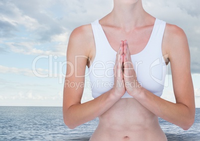 Woman Meditating by sea