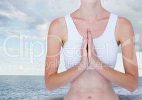 Woman Meditating by sea