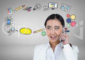 Businesswoman on phone with business graphic drawings