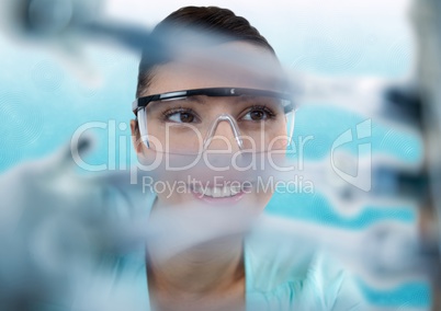 Close up of woman through electronics against blue and white background