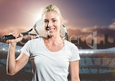 Tennis player smiling against stadium and skyline
