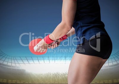 Table tennis player lower body against stadium with bright lights and blue sky