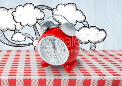 Clock with clouds drawings on red tablecloth