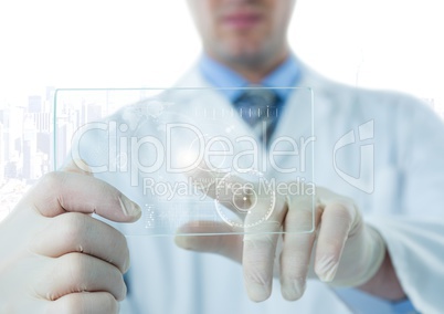 Man in lab coat pointing at white interface and flare on glass device against white skyline