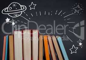Standing books with white space doodles against navy chalkboard