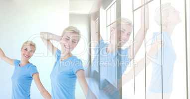 Woman exercising relaxing yoga by window