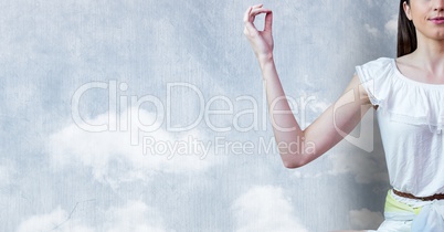 Woman Meditating peaceful by cloud wall