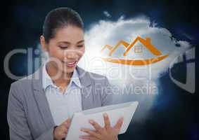 Business woman on tablet in front of cloud with orange house graphic