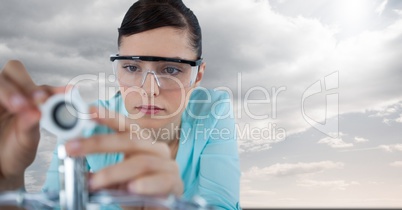 Close up of woman with electronics against sky