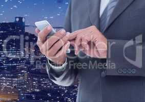 Businessman touching phone against Night city with connectors