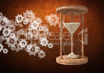 Egg Timer with sand and cog wheel settings icons against brown background