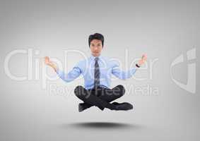Businessman Meditating floating against grey background