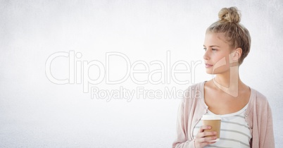 Woman looking to the side coffee cup against white wall