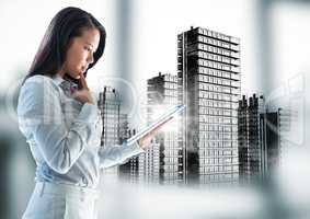 Portrait of business woman with tablet and flare against black buildings graphic and blurry grey win