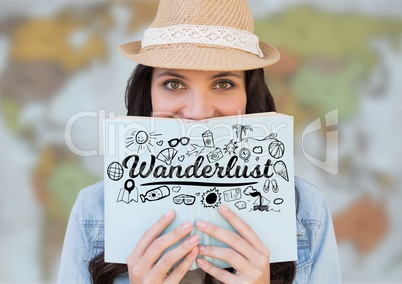 Woman reading with black wanderlust doodles against blurry map