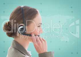 Close up of travel agent with headset against green map