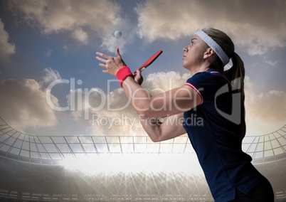 Table tennis player against stadium and sky with clouds