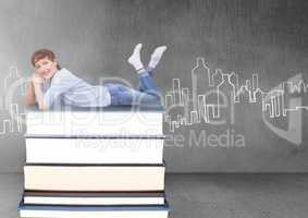 Woman lying on Books stacked by city drawing