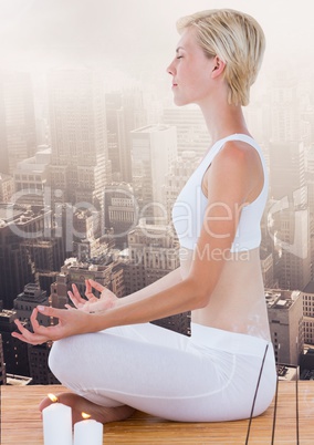 Woman Meditating peaceful over city