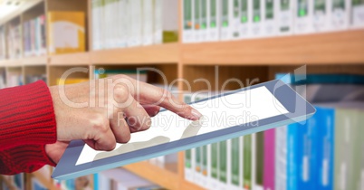 hand on tablet in Library