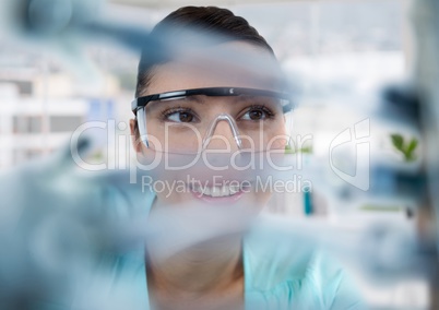 Close up of woman through electronics in office