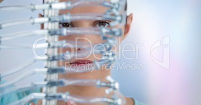 Close up of woman through electronics against blurry background