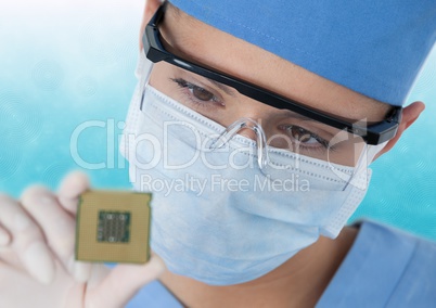 Close up of masked woman with electronics against blue and white background