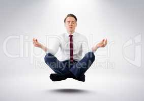 Businessman Meditating  floating against grey background