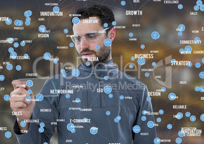 Man with glass tablet against Night city with connectors