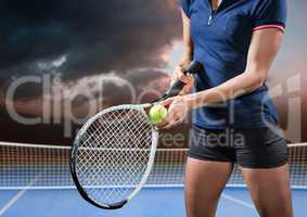 Tennis player on court with evening sky