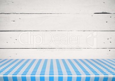 Picnic table against white wood panel