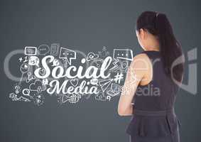 Businesswoman with social media graphics drawings