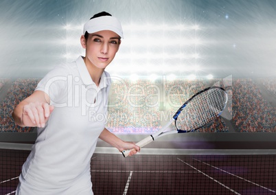 Tennis player on court with bright lights and audience