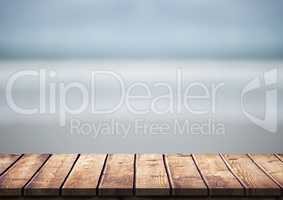 Wood table against blurry beach