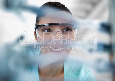 Close up of woman through electronics against blurry background